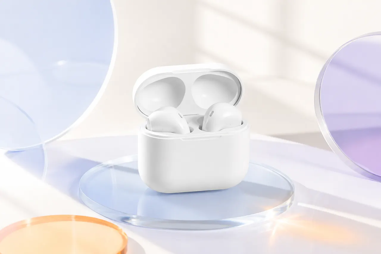 Unbranded white wireless earbuds in a bright neutral product scene